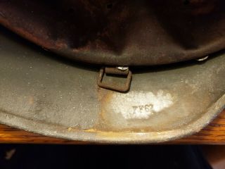 M 40 German helmet with liner.  No chinstrap.  Shows wear.  Stamped EF62. 11