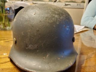 M 40 German helmet with liner.  No chinstrap.  Shows wear.  Stamped EF62. 2