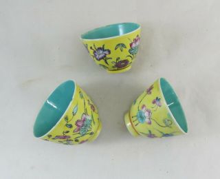 Three Chinese Porcelain Bowls Decorated With Flowers On A Yellow ; 20th Century;