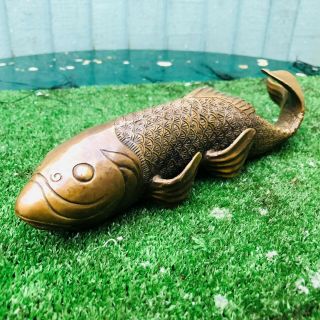 Oriental Bronze Koi Carp With The Intricate Detailing Of Antique Years