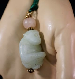 Pale Green Jade Monkey Pendant Carving With Pink Quartz Bead On Green Cord
