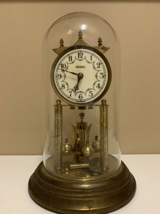 Rensie Dome Clock.  Rotating Pendulum.
