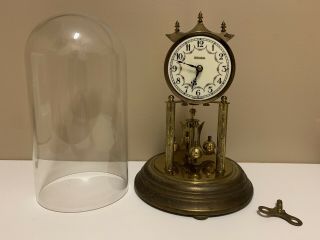 Rensie Dome Clock.  Rotating pendulum. 6