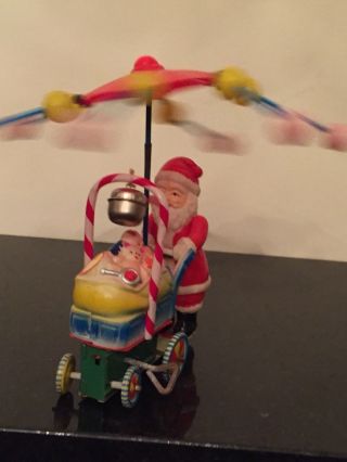 Vintage Toy Santa Claus Celluloid Tin Litho Wind Up Spinning Umbrella Baby Buggy 2