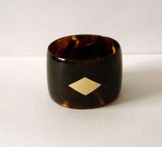 A Vintage Faux Tortoiseshell Napkin Ring With A Yellow Gold Vacant Cartouche