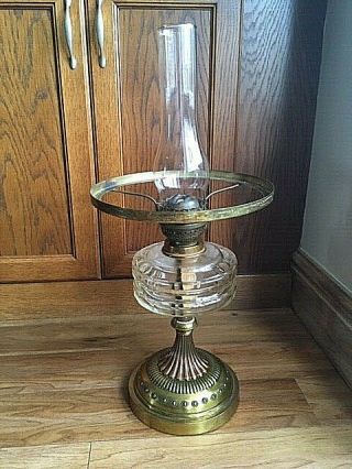 Antique Oil Lamp With Clear Glass Font And Chimney With Duplex Burner