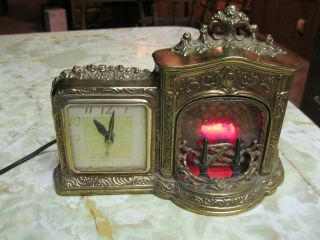 Vintage United Clock Model 455 W/lighted Fireplace Gold Gilded Great