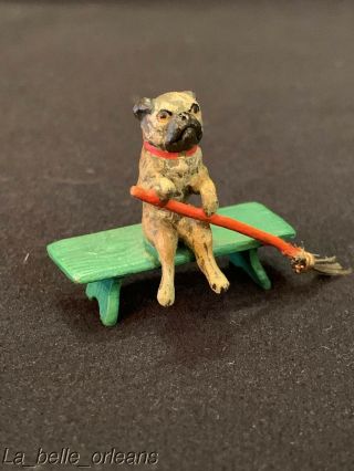 Antique Austrian Cold Painted Vienna Bronze Pug Seating On Bench With Broom.