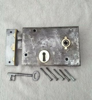 Edwardian Iron And Brass Rim Lock With Keep,  Key,  And Fixing Screws