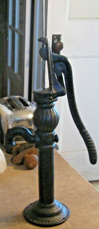 Vintage Water Well Pump Hand Cranked Black Cast Iron Round Base Curved Spigot