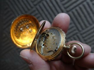 A.  W.  C0.  Antique 14K solid gold pocket watch with 3 factory Diamonds 4