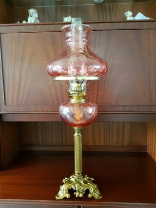 Antique Oil Lamp With Cranberry Glass Font & Shade,  Brass Corinthian Column Base