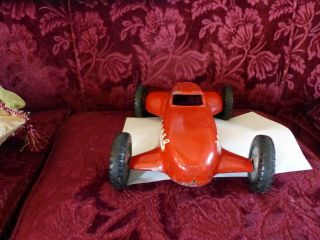 large (almost 14 inches) aluminum 1950 ' s era race car toy,  possibly tether car 2
