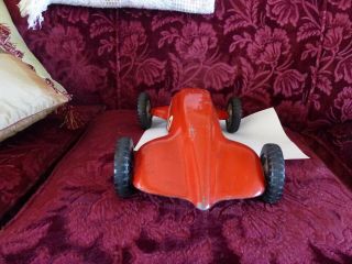 large (almost 14 inches) aluminum 1950 ' s era race car toy,  possibly tether car 4