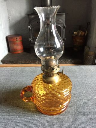 Antique Hand Oil Lamp With Amber Coloured Glass Base.