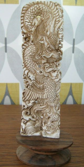 Unusual Carved Buffalo Bone Statue Of A Chinese Dragon Fighting A Pheonix