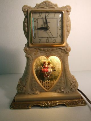 Vintage United Lighted Motion Clock,  Boy And Girl On Swing