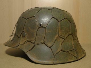 German M - 42 Helmet.  Size 62.  Camo & Chicken Wire Net.  Name.  With Liner.