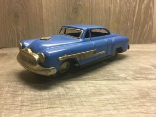 Antique 1950s De Soto Friction Toy Car 8x3 Inch Blue.  Missing One Hubcap