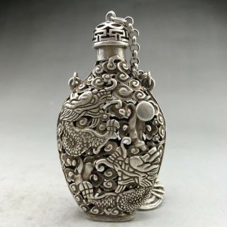 Ancient Tibetan silver snuff bottles are carved by hand with dragon designs 4