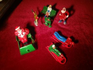 Vintage Set Of Cast Iron Santa On A Sleigh,  Ice Skating Figures And Sled Riders