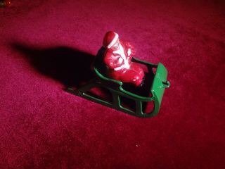 VINTAGE SET OF CAST IRON SANTA on a SLEIGH,  ICE SKATING FIGURES AND SLED RIDERS 2