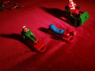 VINTAGE SET OF CAST IRON SANTA on a SLEIGH,  ICE SKATING FIGURES AND SLED RIDERS 4