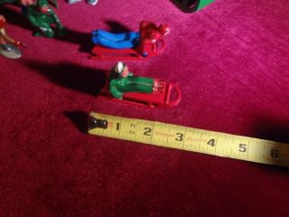 VINTAGE SET OF CAST IRON SANTA on a SLEIGH,  ICE SKATING FIGURES AND SLED RIDERS 8