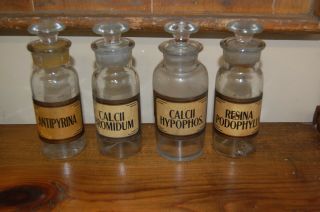 4 Antique Apothecary Jars With Glass Stoppers And Gold Trim Gum Labels