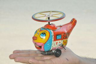 Vintage Wind Up Fire Chief F.  D Fish Shape Helicopter Tin Toy