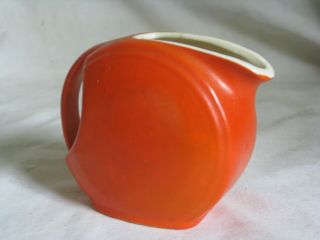 Vintage Ceramic Mid Century Modern Small Orange Pitcher Retro Handled Round Disc