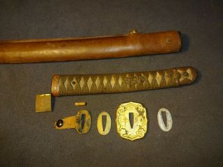 Japanese WWll officer ' s sword in combat mountings,  