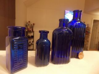 Set Of 4 Old Poison Bottles
