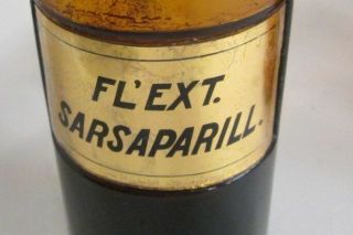 ANTIQUE AMBER GLASS APOTHECARY BOTTLE W\PORCELAIN LABEL FL ' EXT.  SARSAPARILL 5 3