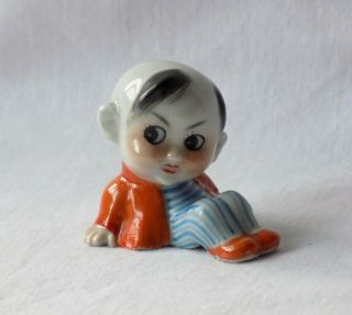 Charming Small Antique Porcelain Figure.  Modelled As A Chinese Boy.  Hand Painted