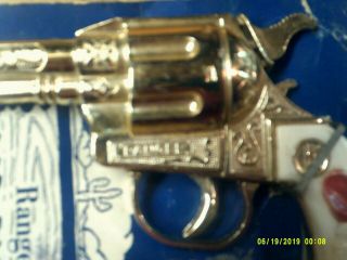 Kilgore Ranger cap pistol (on the card) hop a long on handle?? 2