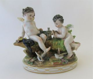 Antique Dresden Volkstedt Porcelain Figural Group Of A Putto With Birds