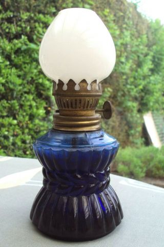 Vintage Blue Glass Small Oil Lamp With White Glass Chimney.
