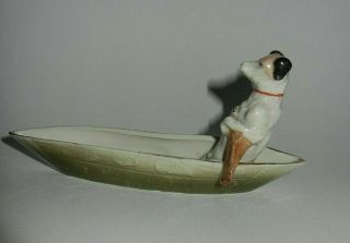German Pink Pig Fairing Figure Jack Russell Terrier Rowing A Canoe / Boat