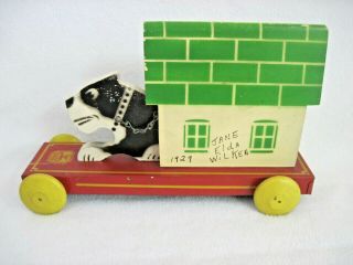 VINTAGE HUSTLER TOY DOG IN DOGHOUSE MOTION PULL TOY METAL & WOOD STERLING IL 3