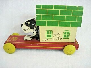 VINTAGE HUSTLER TOY DOG IN DOGHOUSE MOTION PULL TOY METAL & WOOD STERLING IL 4