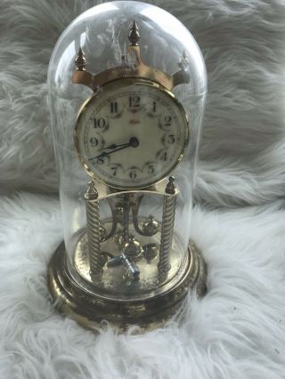Kundo Anniversary Clock With Key Porcelain Face And Globe