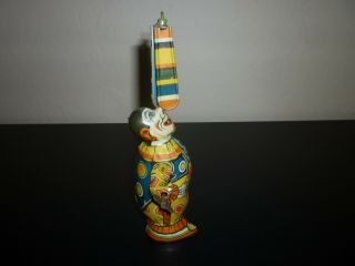 J CHEIN CIRCUS CLOWN VINTAGE 1930 ' s TIN WIND UP WITH SPINNING PADDLES.  EXC 4
