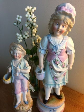 Set Of 2 Antique Gebruder Heubach Porcelain Statues.  Girl 13” & Boy 7.  5” 1890’s