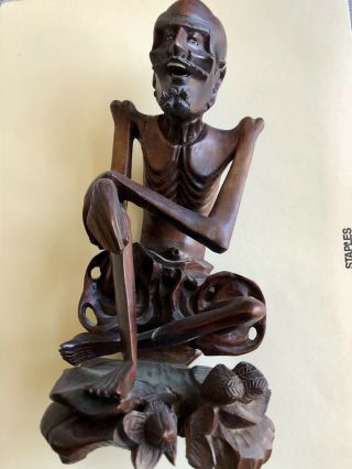 Old Chinese Wise Man Sitting On Lotus Leaf Wood Carving Statue.  Asian Wood Art