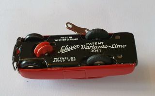 Vintage post war clockwork Schuco Varianto - Limo 3041 tinplate car near Tin 6