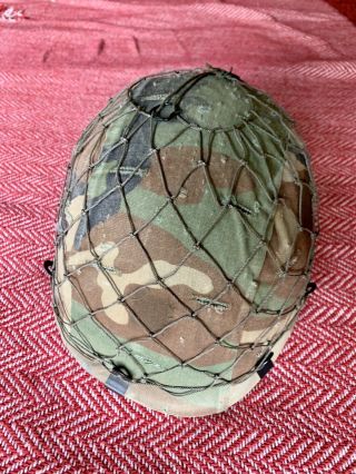U.  S.  ARMY HELMET FROM THE 1980s WITH WOODLAND COVER AND NETTING IN TACT 5
