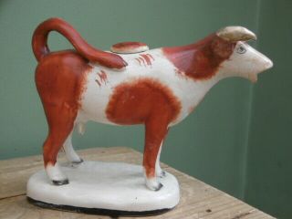 Mid 19thc Staffordshire Red & White Cow Creamer Figure C.  1860