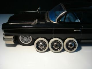 Cadillac Bandai Japan 17” Tin Friction 1961 Cadillac.  Only 3 Hubcaps