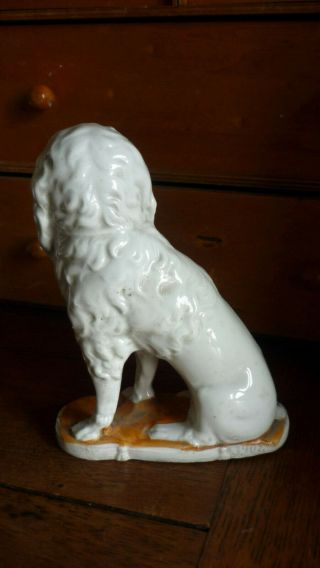 Antique German Bisque poodle Dog Figurewith basket.  6” tall. 3